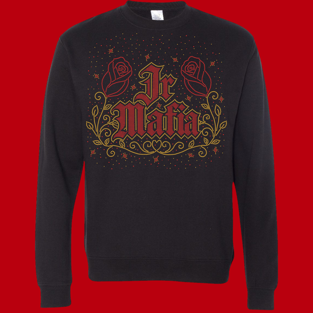 Black sweatshirt with a rhinestone-style gold and red design featuring two roses and ornate scrollwork surrounding bold lettering.