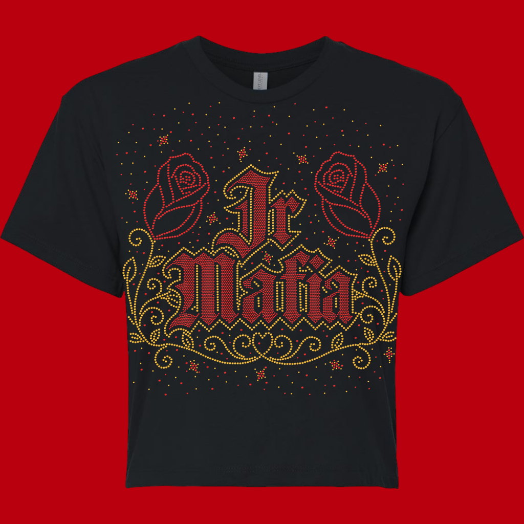 Black T-shirt featuring a red-and-gold rhinestone-style decorative design with two roses and ornate lettering across the chest.