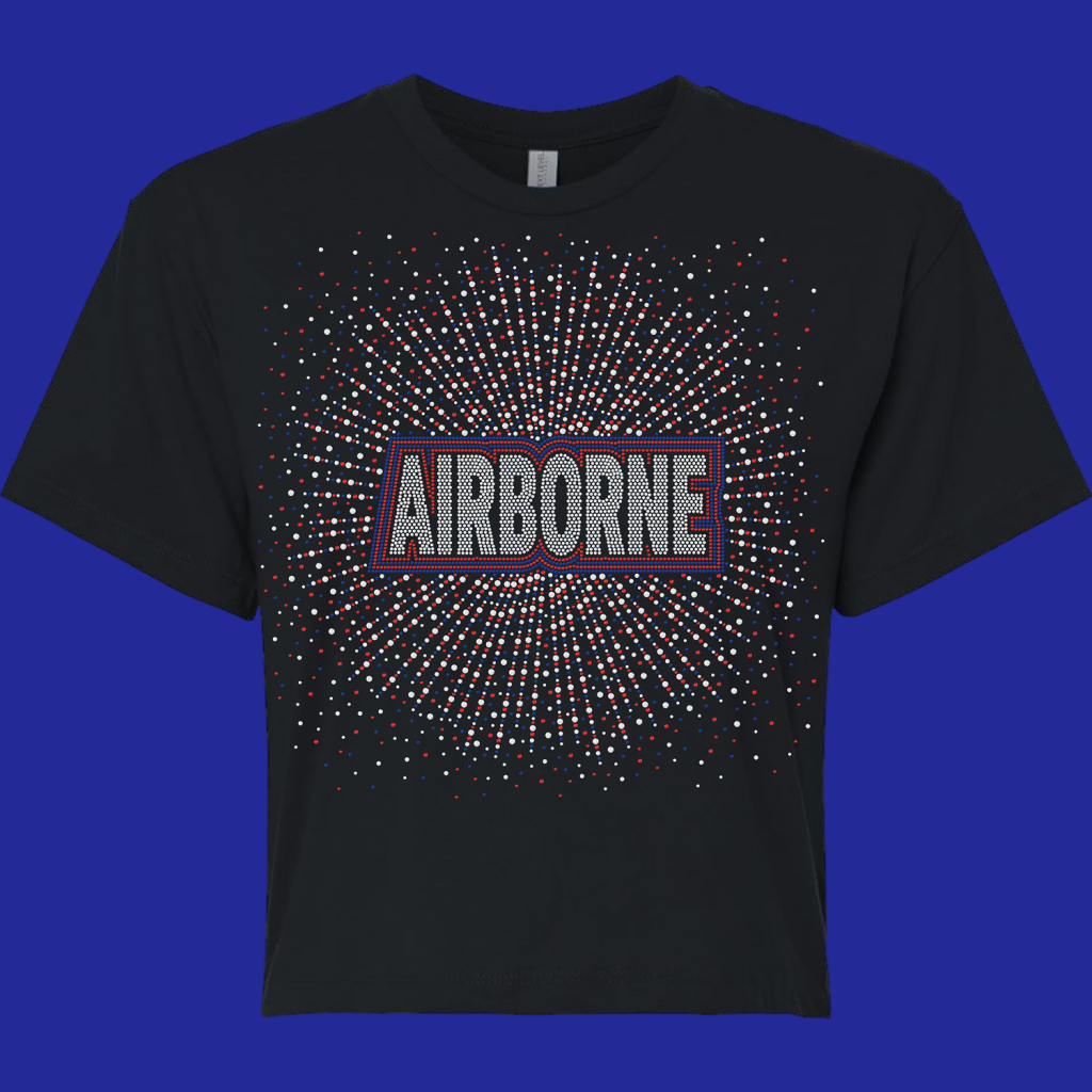 Black T-shirt with rhinestone-studded 'AIRBORNE' logo and a red/blue/white dot burst pattern radiating outward.