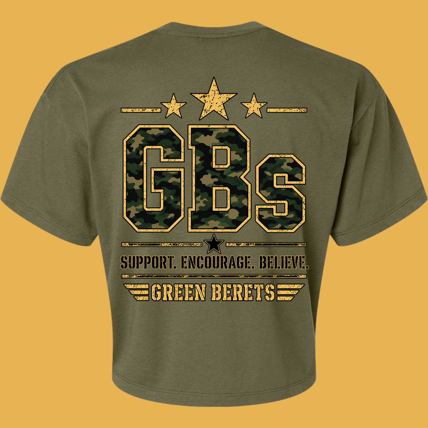 Olive-green T-shirt with a large camel camouflage 'GBS' logo, gold distressed outline, and star accents.