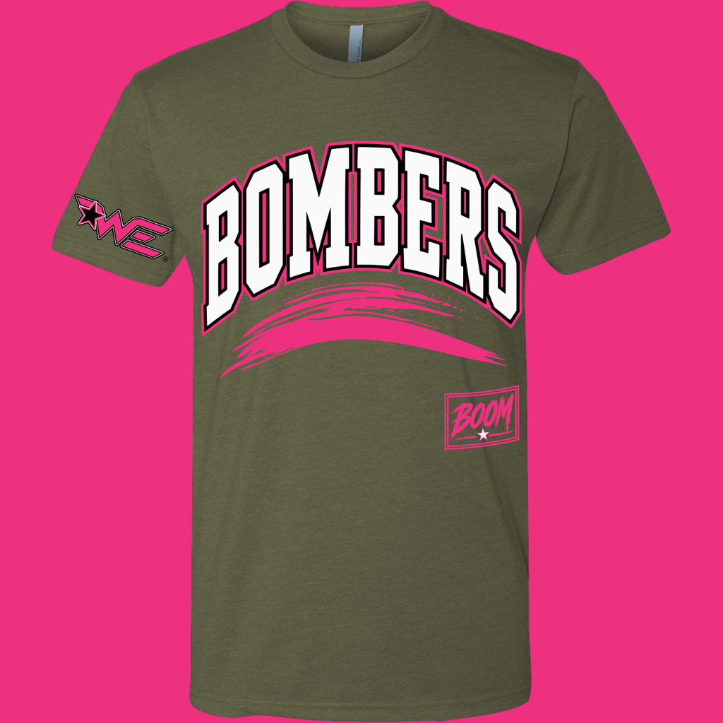 Olive green T-shirt with bold white 'BUMBERS' lettering outlined in pink, a pink curved brush stroke underneath, and a pink 'BOOM' patch on the lower right hem area.