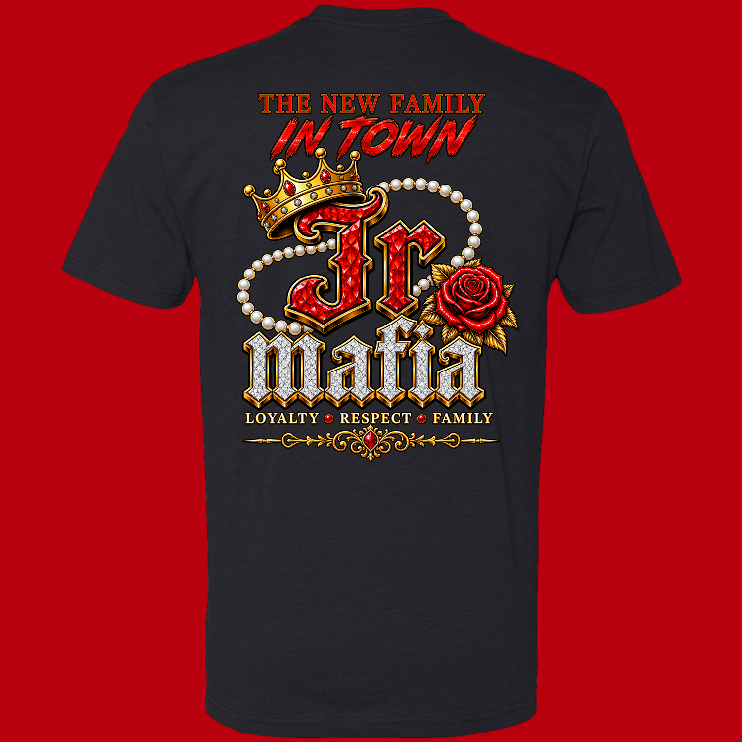 Dark T-shirt featuring a jeweled JC Mafia logo with crown, pearl necklace, red rose, and the words ‘The New Family in Town’ and ‘Loyalty Respect Family’.
